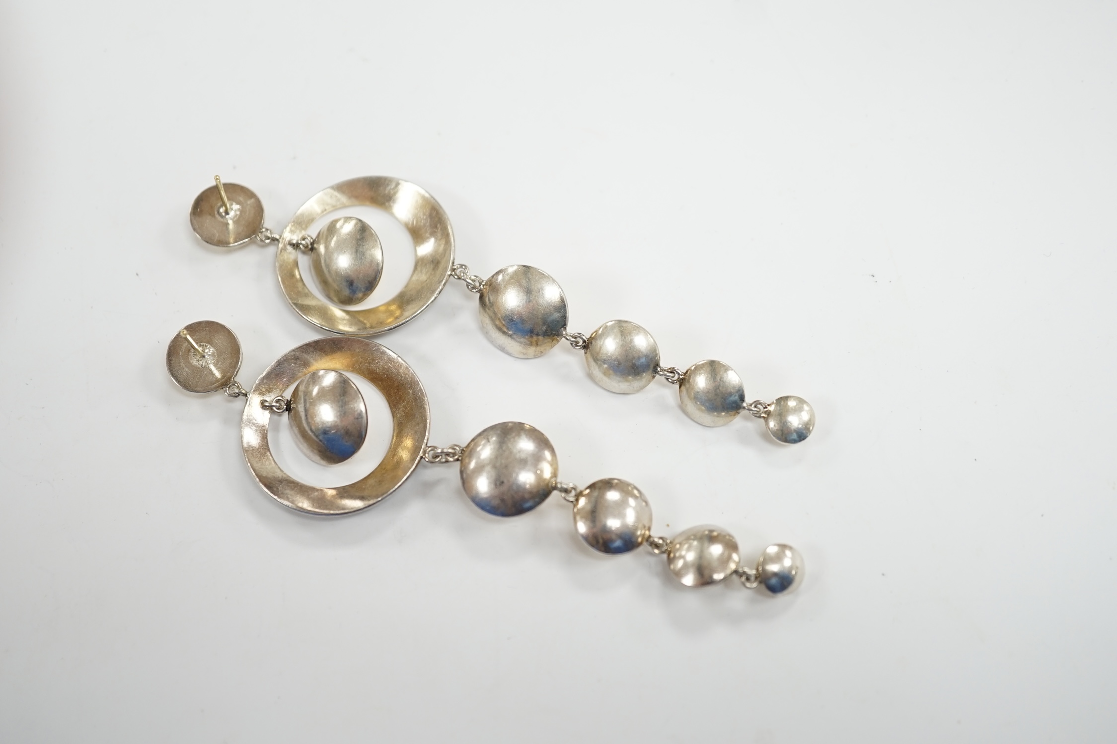 A pair of yellow and white metal diamond and black onyx set graduated disc drop earrings, 93mm, gross weight 23.8 grams.